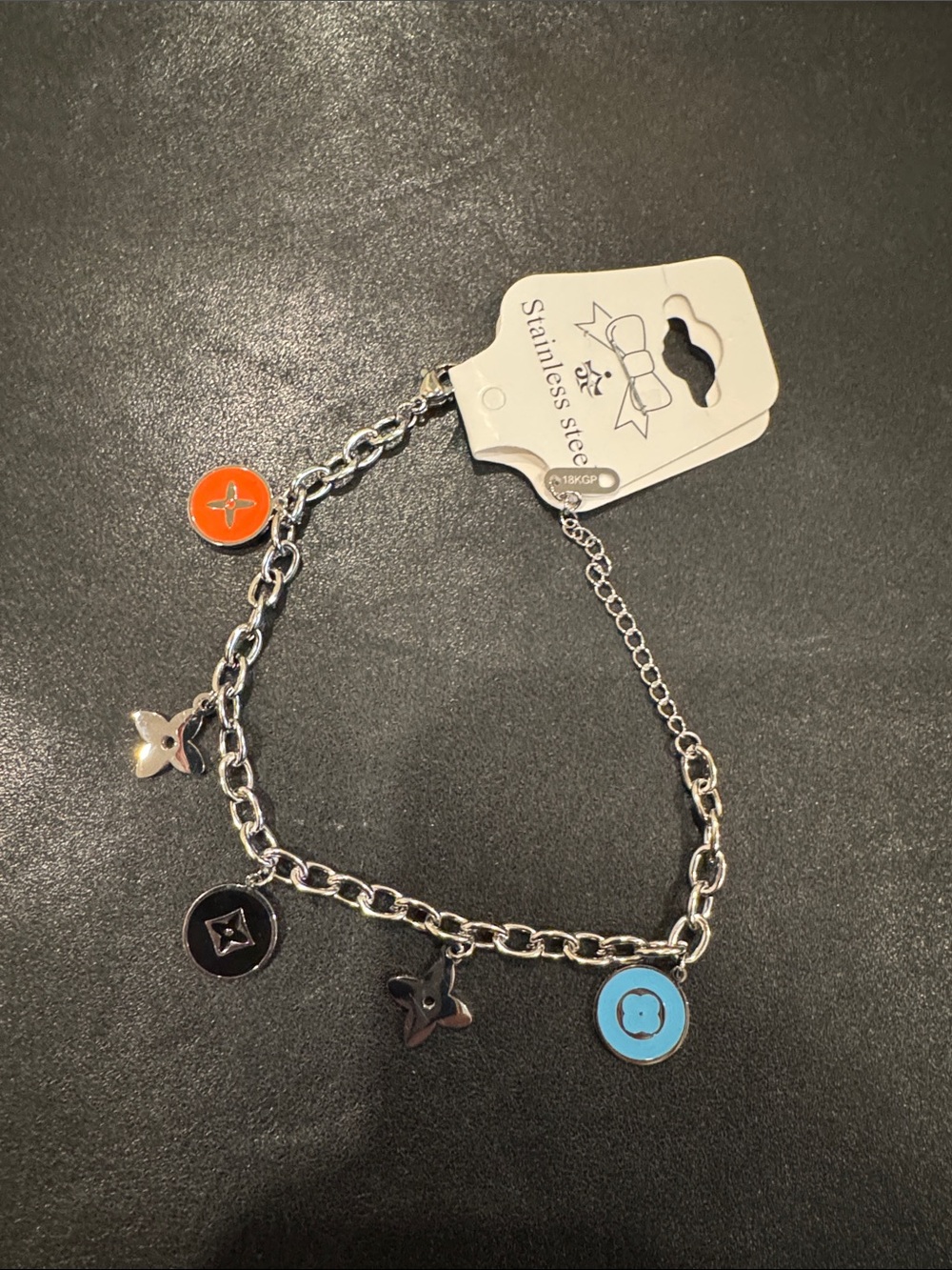 Stainless steel Silver Charm Bracelet with Orange, Black, and Blue Enamel Discs
